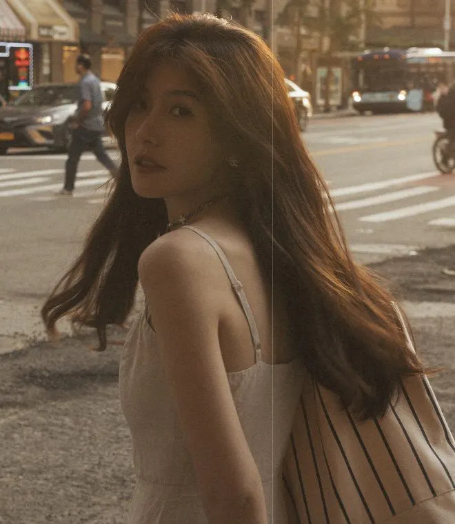 A cinematic portrait in late afternoon city light